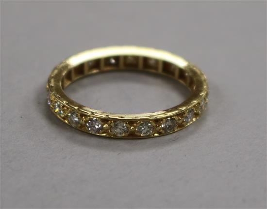 A yellow metal and diamond set full eternity ring, size Q.